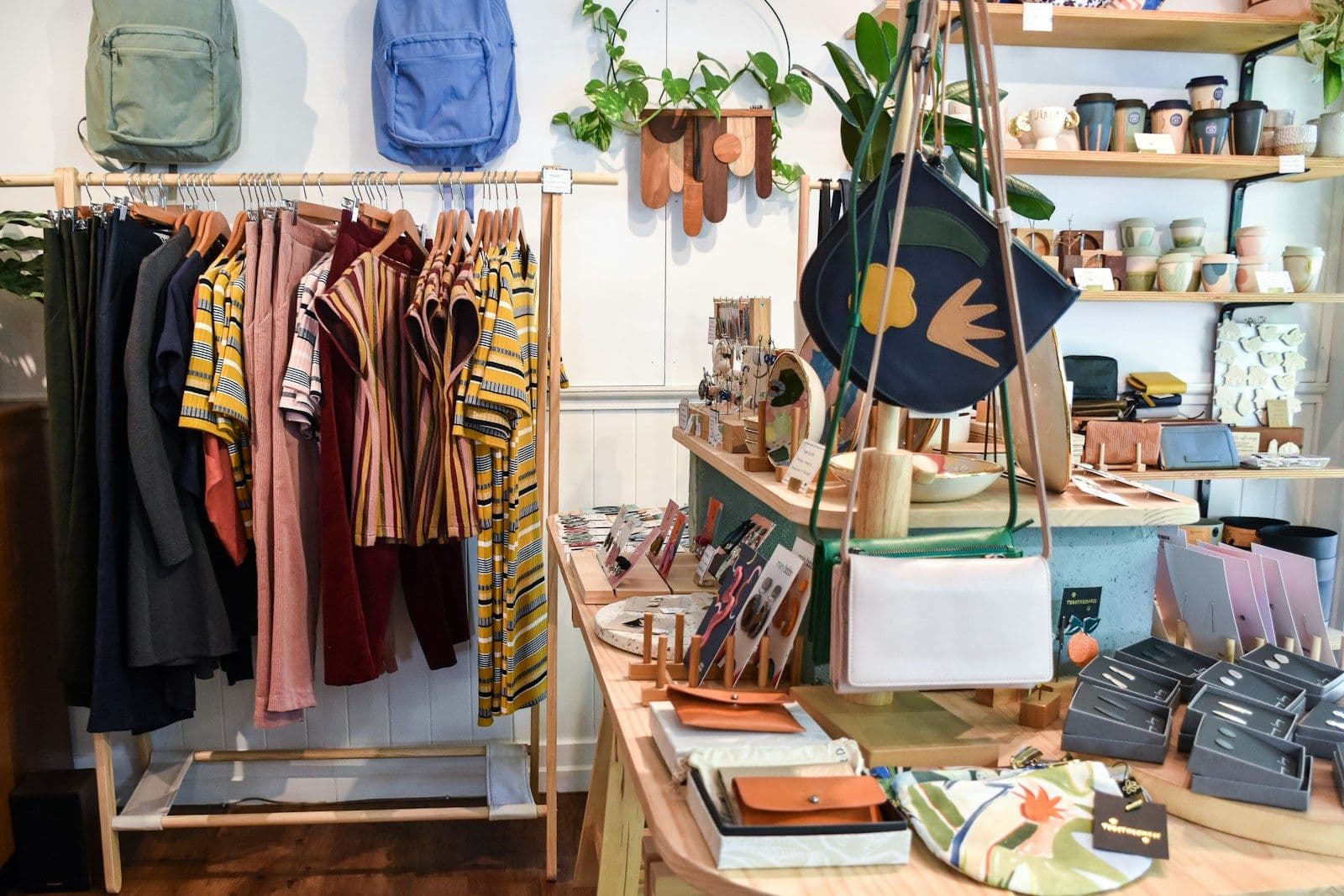 Clothes rails, bags and gifts on display in an independent shop